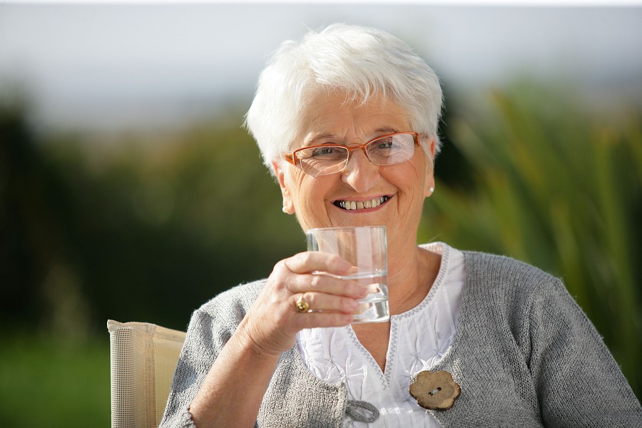 Home Care Senior woman with a glass of water